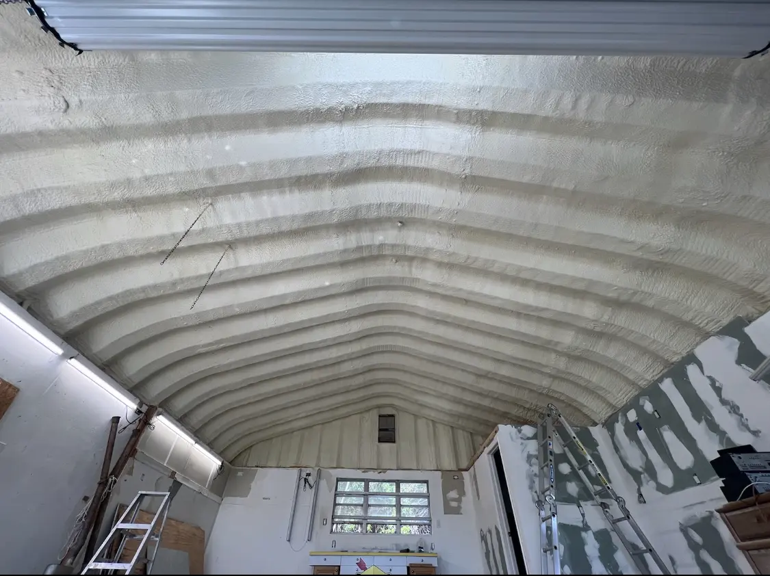 Spray polyurethane foam applied to the underside of a metal roof deck in Kahaluu